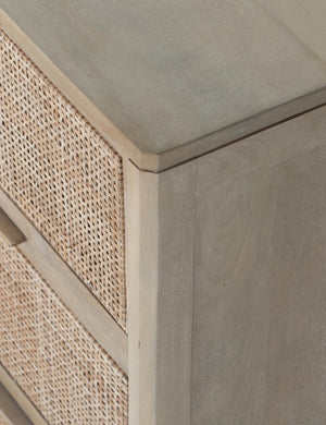 Corner view of the Hannah light wood 6-drawer dresser with cane-front drawers