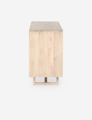 Side view of the Margot whitewashed natural mango wood sideboard with cane doors.