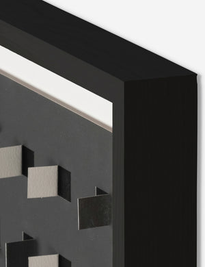Corner of the See through small charcoal gray and black wall art