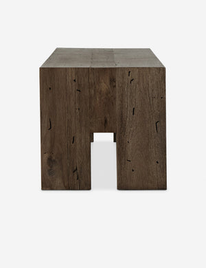 Side view of the Bevan chunky leg distressed wood bench in brown.