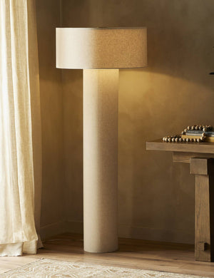 Solstice monochromatic linen column floor lamp styled next to a console table.