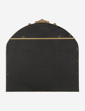 Rear view of the Tulca arched gold mirror with flat bottom edge and traditional scroll detailing.