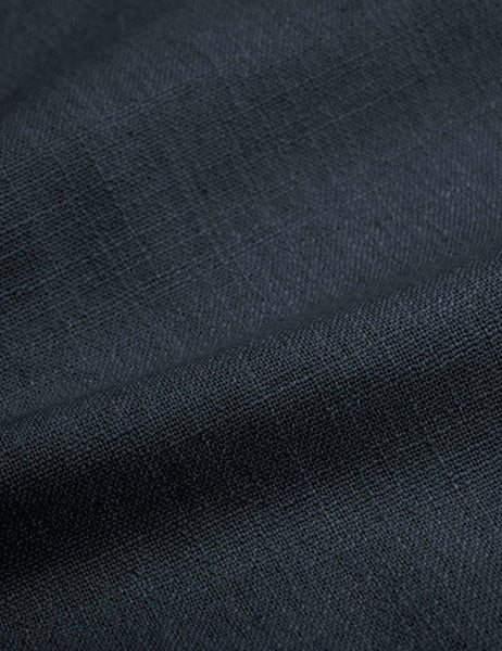#color::navy-linen #size::cal-king #size::full #size::king #size::queen #size::twin | Detailed shot of the navy linen on the Adara navy linen upholstered bed.