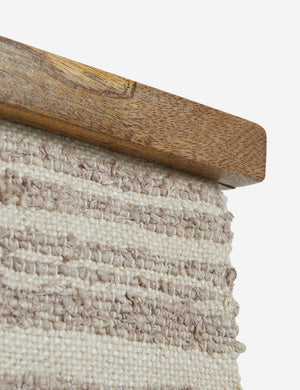 Close up of the frame of the Alvah handwoven textural striped textile wall hanging.
