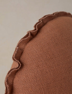 Close up of the Arlo linen flange trim round pillow.