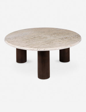 Aleda round travertine and wood mixed-material coffee table.
