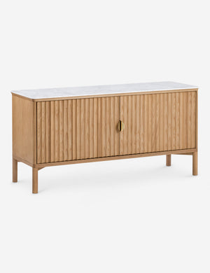 Angled view of the Matija marble top, reeded door media console
