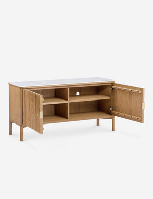 Both doors open to the inside of the Matija marble top, reeded door media console