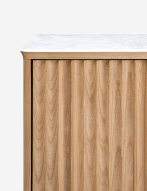 Close up of the Matija marble top, reeded door media console