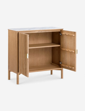 Matija marble top, reeded door front cabinet with both doors open