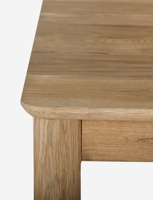 Close up of the Lussier natural oak tapered leg dining table