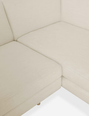 Close-up of the inner corner of the Estee Natural Linen Sectional Sofa