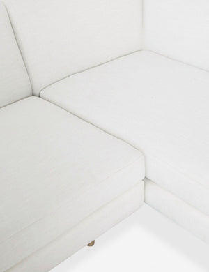 Close-up of the inner corner of the Estee White Linen Sectional Sofa