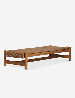 Gally wicker and teak outdoor chaise without the seat back.
