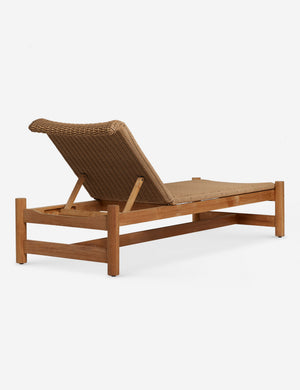 Angled back view of the Gally wicker and teak outdoor chaise.