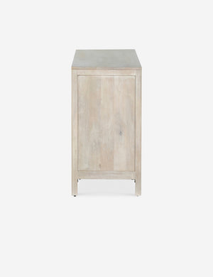 Side view of the Hannah light wood 6-drawer dresser with cane-front drawers