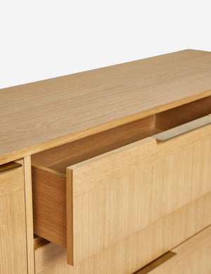 The top drawer of the Hillard white oak veneer five drawer sideboard open
