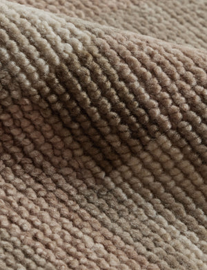 Close up of the Lalan hand-knotted geometric pattern wool rug.