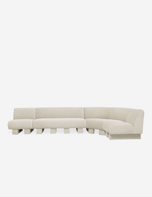 Lena right-facing white boucle sectional sofa with upholstered beam legs.