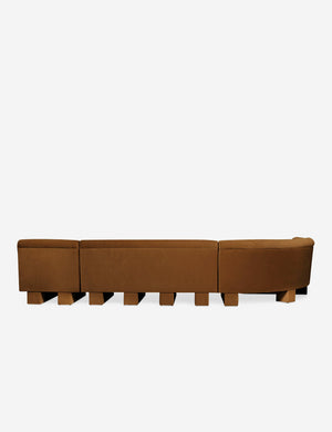 Rear view of the entire Lena left-facing cognac velvet sectional sofa with upholstered beam legs.