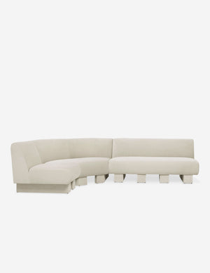Lena left-facing white boucle sectional sofa with upholstered beam legs.
