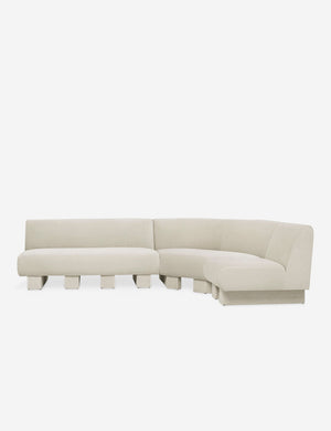 Lena right-facing white boucle sectional sofa with upholstered beam legs.