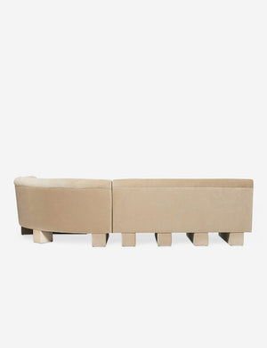 Rear view of the entire Lena left-facing beige velvet sectional sofa with upholstered beam legs.