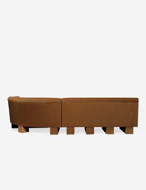 Rear view of the side of the Lena right-facing cognac velvet sectional sofa with upholstered beam legs.