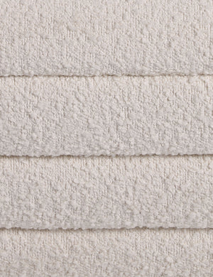 Close up of the Leon textural boucle channel tufted waterfall ottoman by Carly Cushnie.