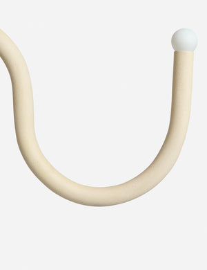 Close up of the Noor sculptural, wavy linear chandelier