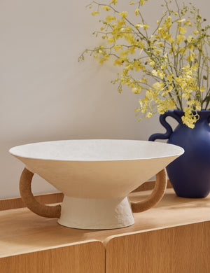 Olea modern decorative pedestal bowl styled on a sideboard cabinet.