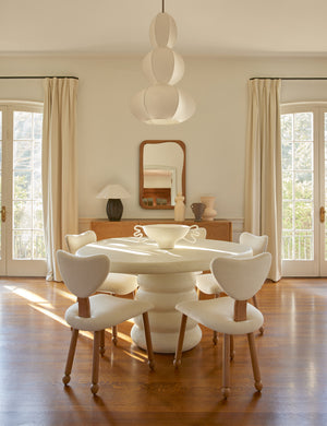 Dining room featuring the Hannu modern round fibercement dining table by Aimee Song
