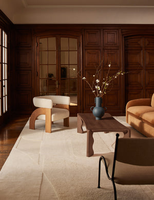 Tosca beaded detailed loop handle ceramic vase by Aimee Song styled on a coffee table in a living room