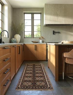 Ovidi heritage motif hand-knotted wool runner rug styled in a kitchen.