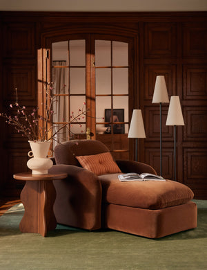 The Sutton Solid Color Hand-Loomed Viscose Rug by Aimee Song styled under a chaise lounge chair