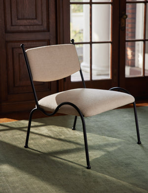 Fidia curved metal silhouette accent chair by Aimee Song