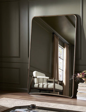 Picart arched base slim frame floor mirror leaning against a wall