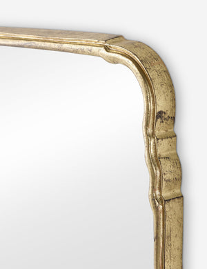 Close up of the frame of the Coudray serpentine gold leaf frame floor mirror