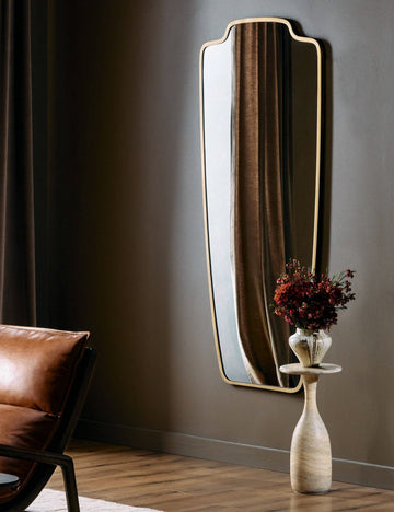 #color::gold | Armond crest-shaped slim frame full length mirror hung on a wall
