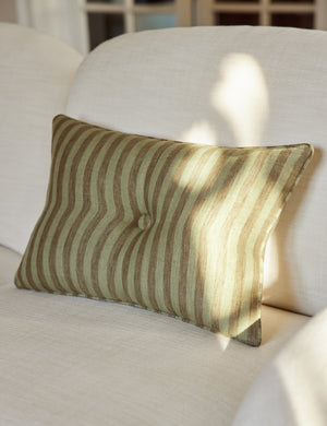 Welby striped tufted button linen throw pillow by Aimee Song styled on a sofa