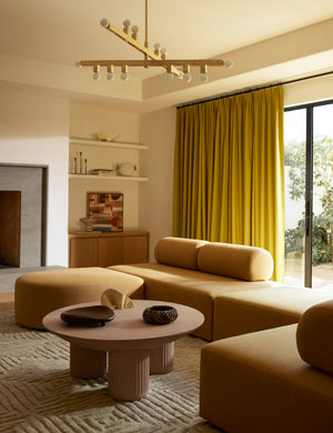 Living room featuring the Carr modern round fluted base coffee table.