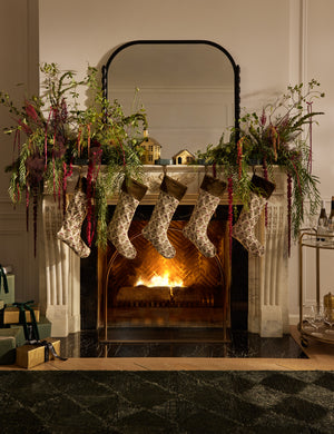 Five Dove floral pattern stockings hanging on a mantel
