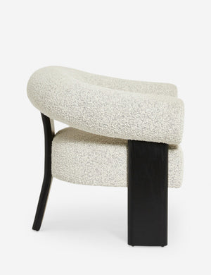 Side view of the Celeste black wood accent chair with wishbone frame