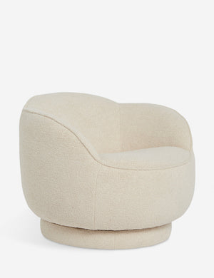 Angled view of the Fern scalloped back boucle upholstered swivel chair