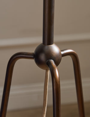 Close up of the base of the Francis slim frame tripod floor lamp by Heidi Caillier