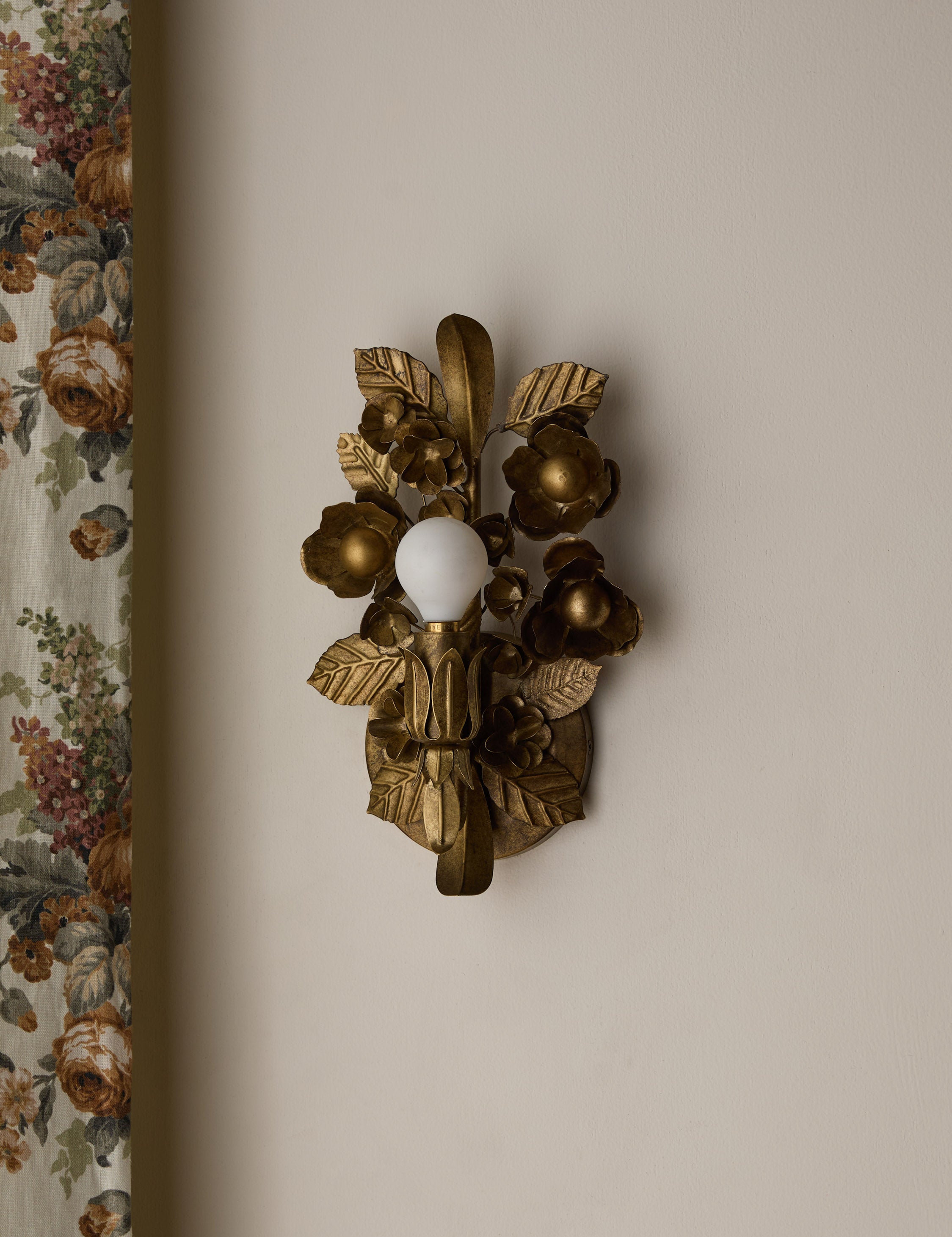 #color::aged-brass | Garda ornate floral metalwork wall sconce by Heidi Caillier
