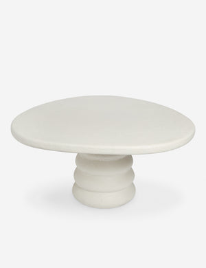 Angled overhead view of the Hannu modern round fibercement dining table by Aimee Song