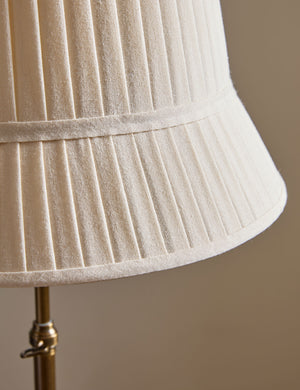 Close up of the shade of the Lily slim metal stem adjustable height floor lamp by Heidi Caillier