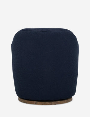 Rear view of Margie rounded barrel swivel accent chair in navy