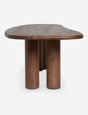 Side profile view of the Nave modern sculptural red oak dining table by Aimee Song
